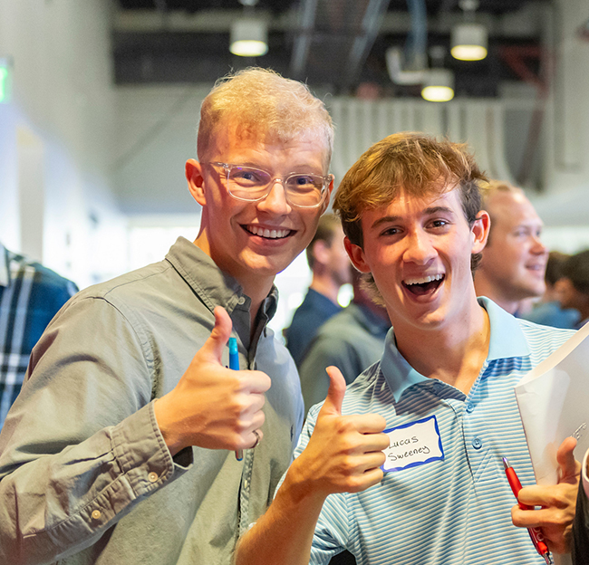 Two students at a conference