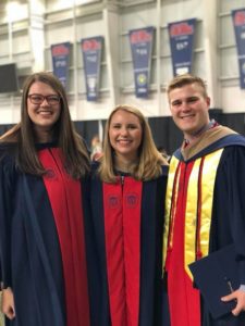 three accountancy students at commencement